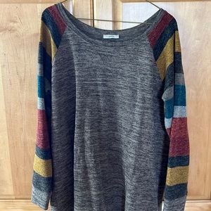 Comfy sweater with a pop of color on sleeves.